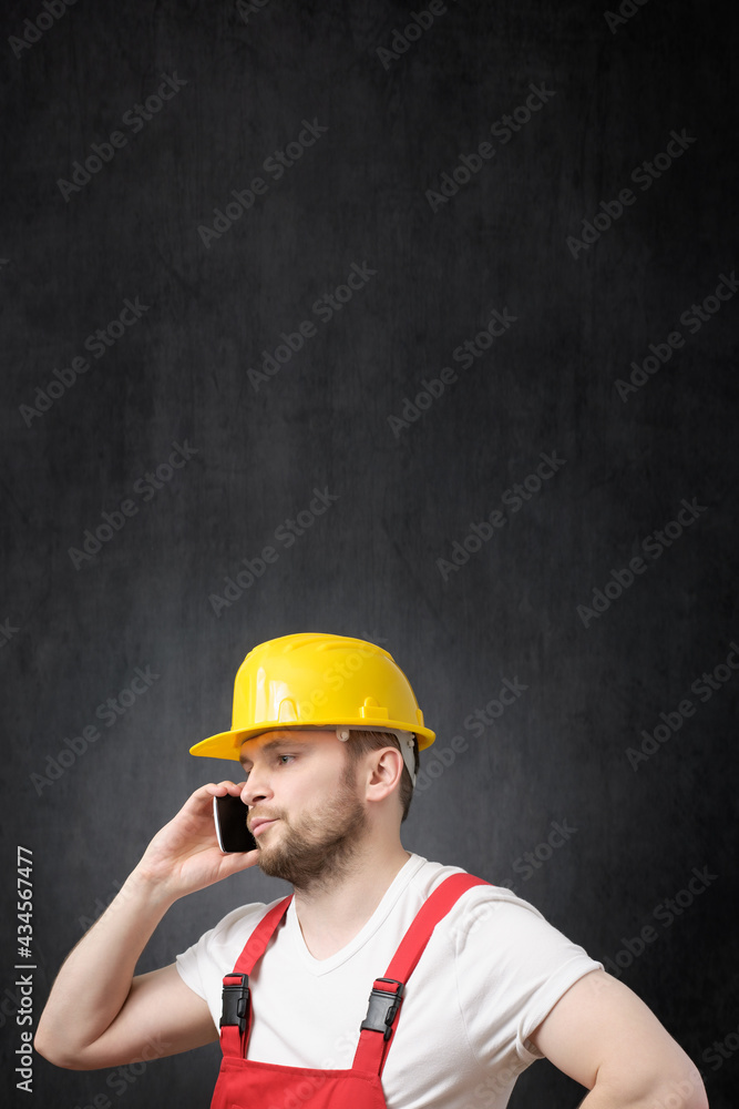 A construction worker using smartphone A construction worker using smartphone