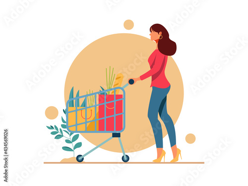 Young beautiful shopping women with shopping chart