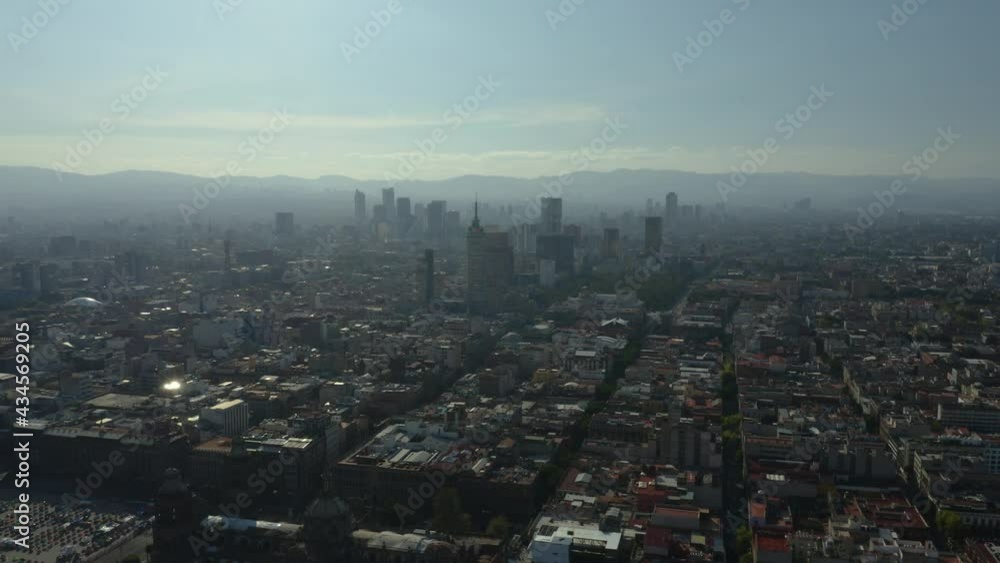 Aerial Orbiting Shot with View of Mexico City Skyscrapers in the Distance on Hazy Day Aerial Orbiting Shot with View of Mexico City Skyscrapers in the Distance on Hazy Day