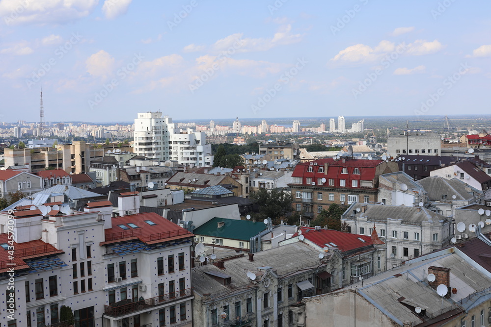 Scenic panoramic view of residential houses on a cloudy day. True modern cityscape of Ukrainian capital. Design of contemporary build in big city. Real urban style of residential building.