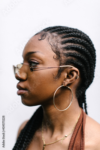 Portrait of woman with sunglasses and braids