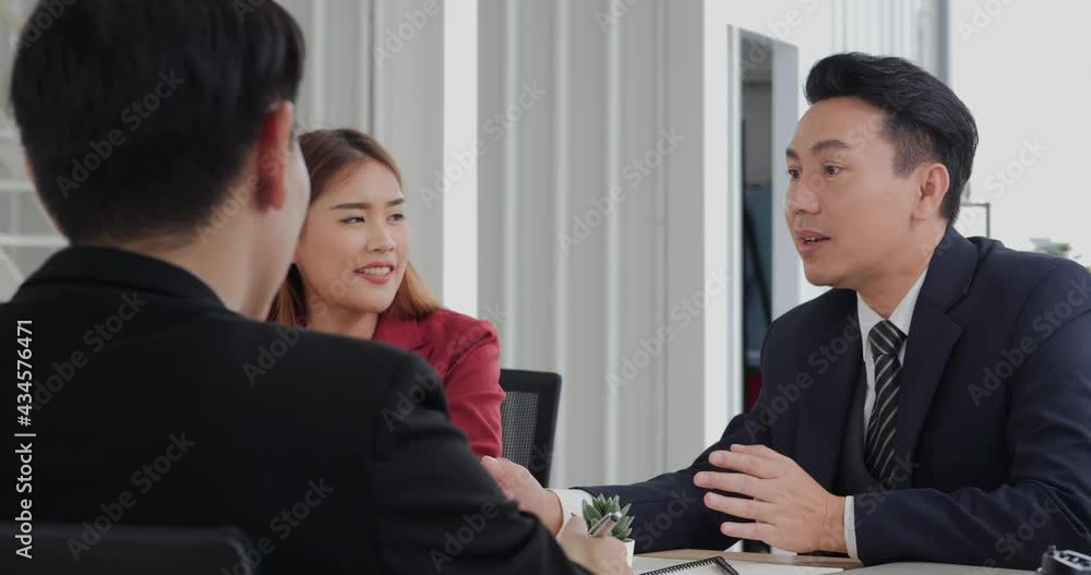 Business man enjoying with team when success to business plan. They talking with happy face and smiling together. Business man enjoying with team when success to business plan. They talking with happy face and smiling together.