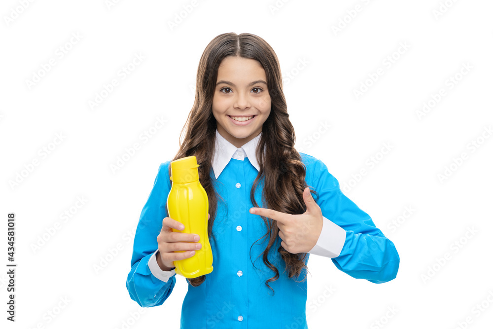 Happy kid point index finger at yellow plastic liquid drinking bottle, beverage product Happy kid point index finger at yellow plastic liquid drinking bottle, beverage product