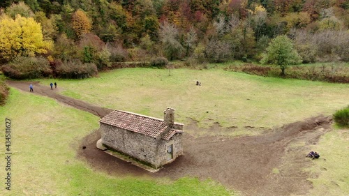 The Santa Margarida volcano with a hermitage in the centre of its crater. La Garrotxa Volcanic Zone Natural Park is a curious environment that overlooks part of the province of Girona. photo