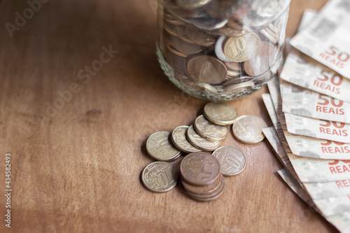 Brazilian currency real money bank notes with coins
 photo