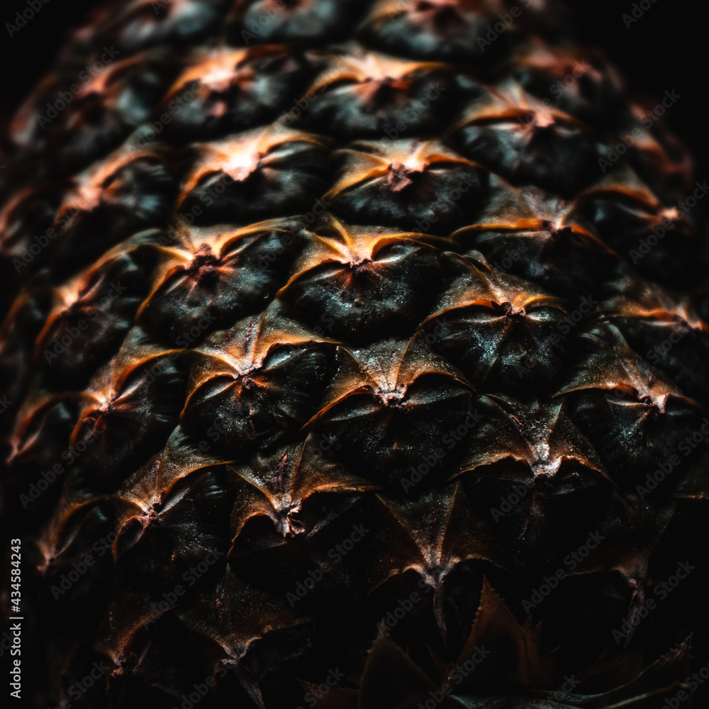 Close-up of pineapple on black background. Macro shot.