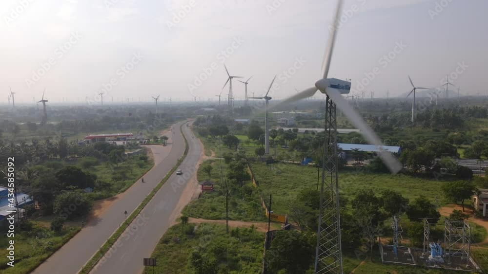 A landscape drone aerial moving shot of a two-lane busy roadway ...