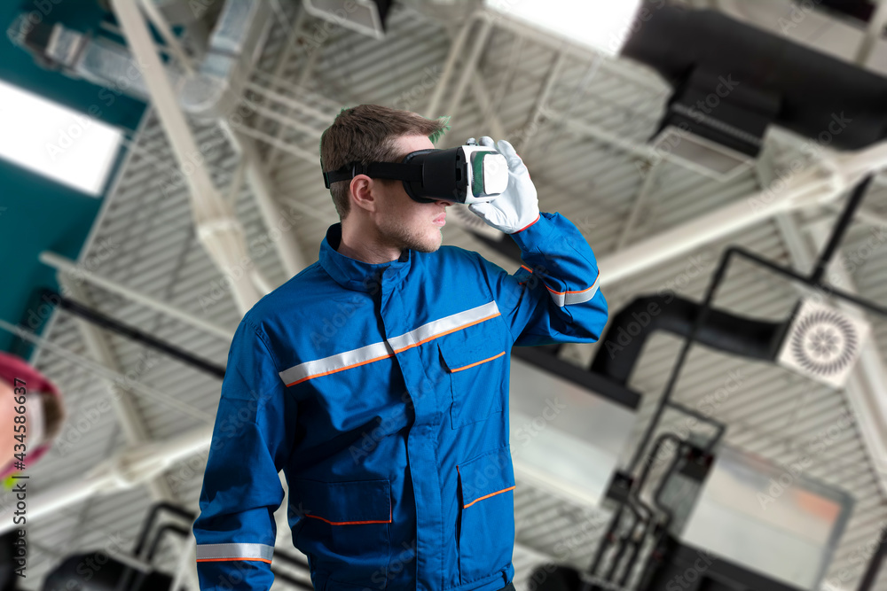 male worker in uniform using virtual reality glasses, new technology glasses male worker in uniform using virtual reality glasses, new technology glasses