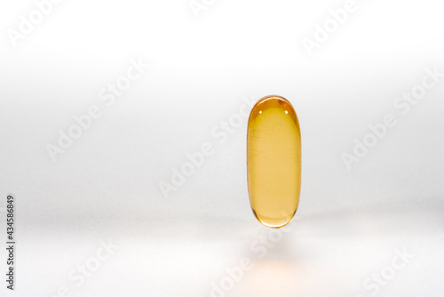 cod liver oil capsule ,fish oil ,food supliment with omega 3 ,heart care . on a white background .