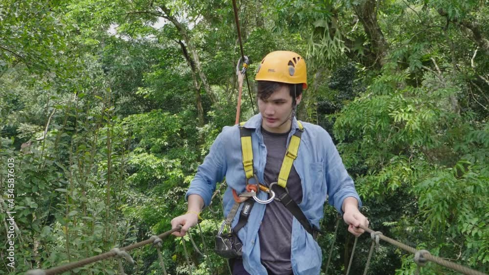 Man Passing The Cable Route High Among Trees
Man Passing The Cable Route High Among Trees