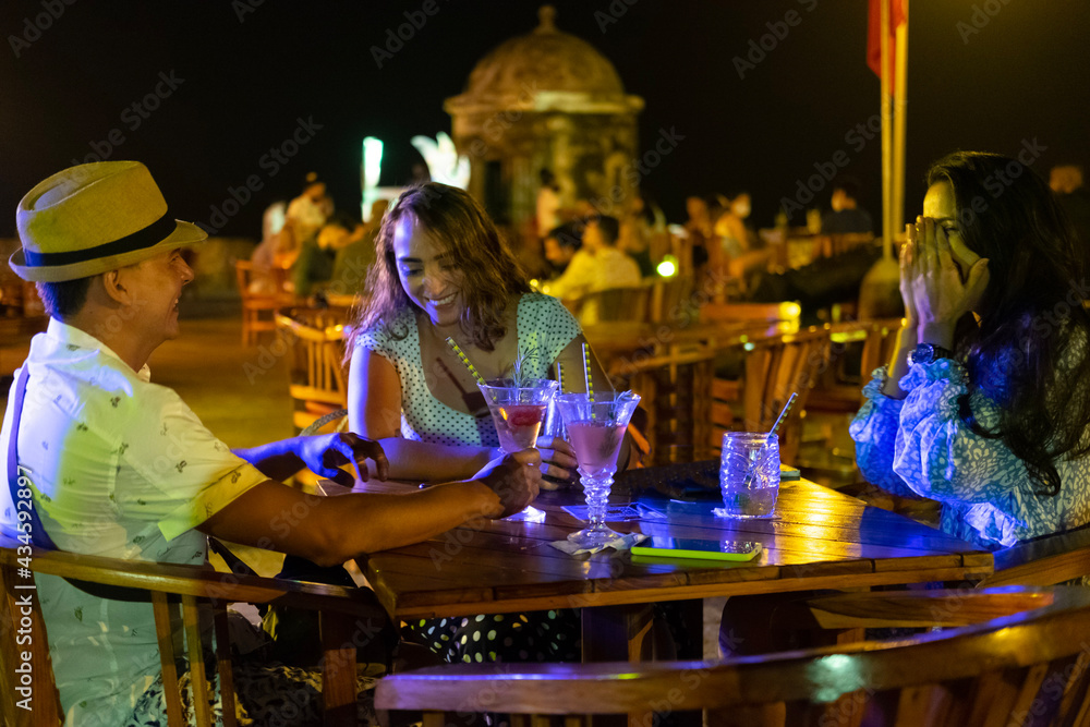 latin friends at terrace party
