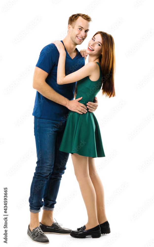Smiling young amorous couple. Full body length portrait of embracing models at happy in love studio concept, isolated over white background. Man and woman posing together. Smiling young amorous couple. Full body length portrait of embracing models at happy in love studio concept, isolated over white background. Man and woman posing together.