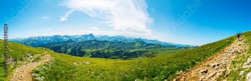 Trekking in European Alps, Kleinwalsertal, Vorarlberg, Austria. View from the plateau of mountain Hoher Ifen (2230m) southwards over Algau Alps, on the left mountain Grosser Widderstein (2533m)