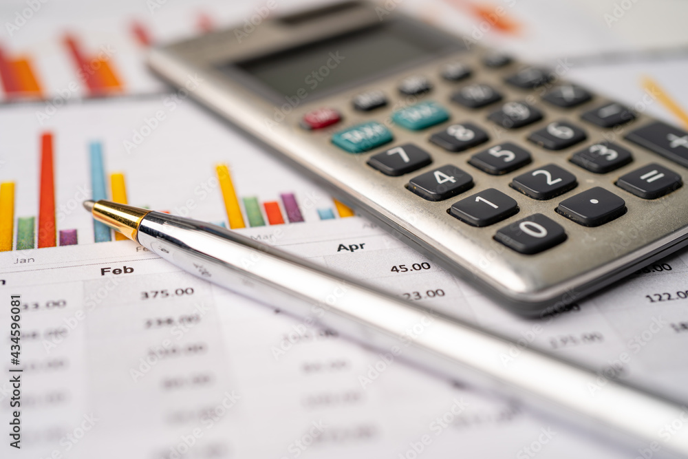 Calculator on graph paper. Finance development, Banking Account, Statistics, Investment Analytic research data economy, Stock exchange trading, Business company concept. Calculator on graph paper. Finance development, Banking Account, Statistics, Investment Analytic research data economy, Stock exchange trading, Business company concept.