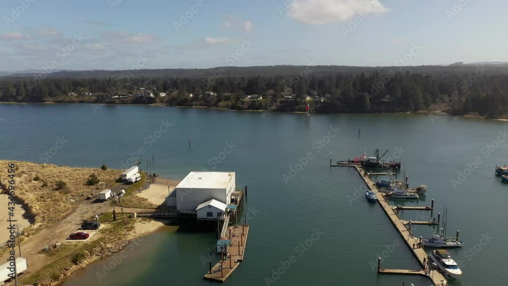 Aerial circle over white building at Charleston Marina complex port of Coos bay, Oregon Aerial circle over white building at Charleston Marina complex port of Coos bay, Oregon