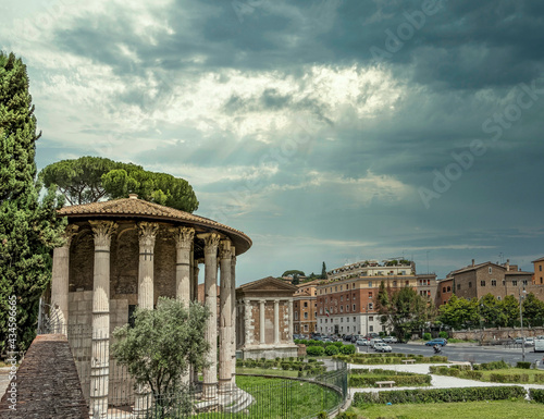 Rome Italy, Boario forum temple and square under dramatic sky and sun rays photo