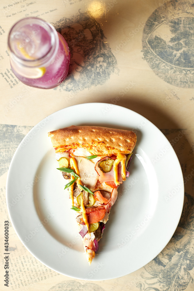 Slice of pizza on a plate, top view Slice of pizza on a plate, top view