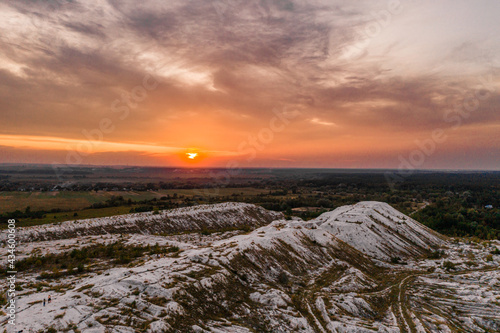 White mountains from phosphorus and gypsum wastes, industrial wastes formed mountains, business activity in Ukraine. photo