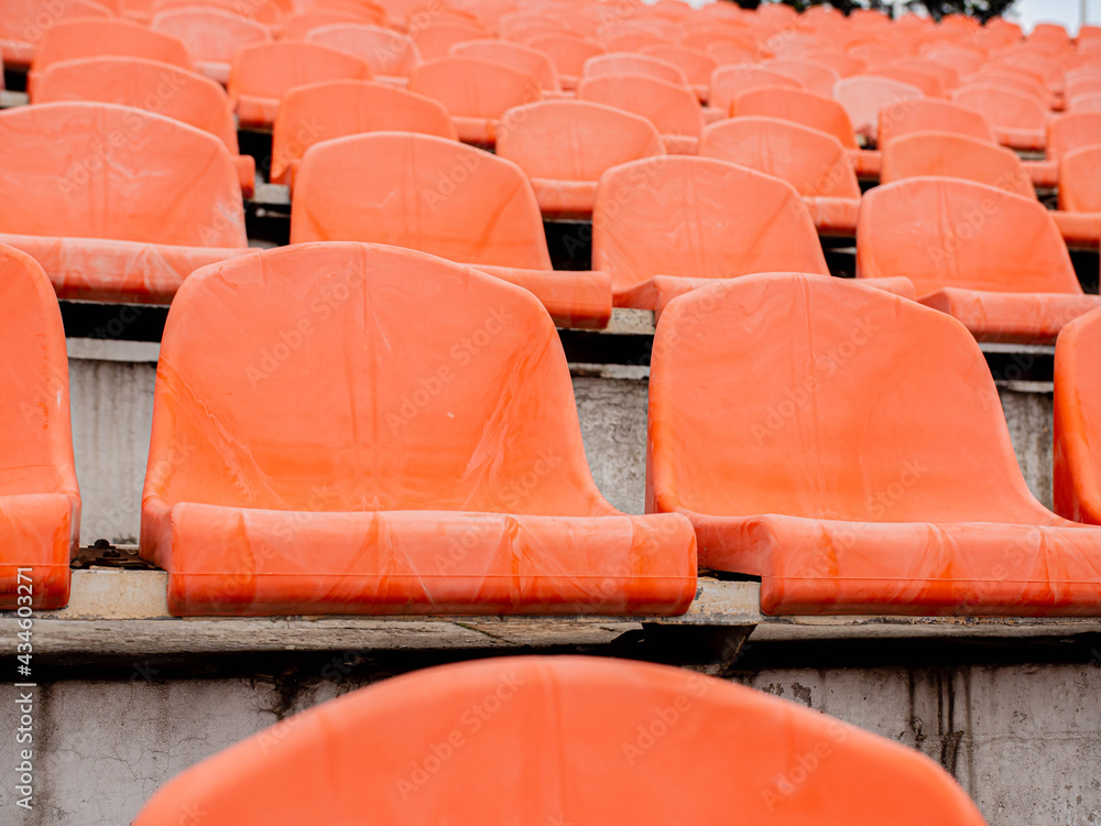 Empty seats in a sports stadium. Lack of spectators at the stadium during the pandemic. Empty seats in a sports stadium. Lack of spectators at the stadium during the pandemic.