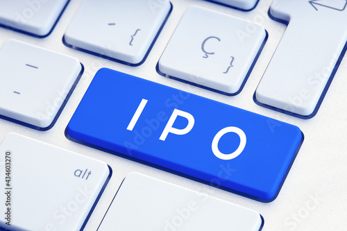 IPO word on blue computer keyboard. Initial Public Offering concept