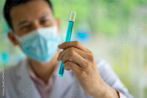 Asian medical scientist working in clinical laboratory for virus vaccine 
