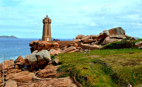 Mean ruz lighthouse, on the pink granite coast in plouman'ach , brittany 
France 
