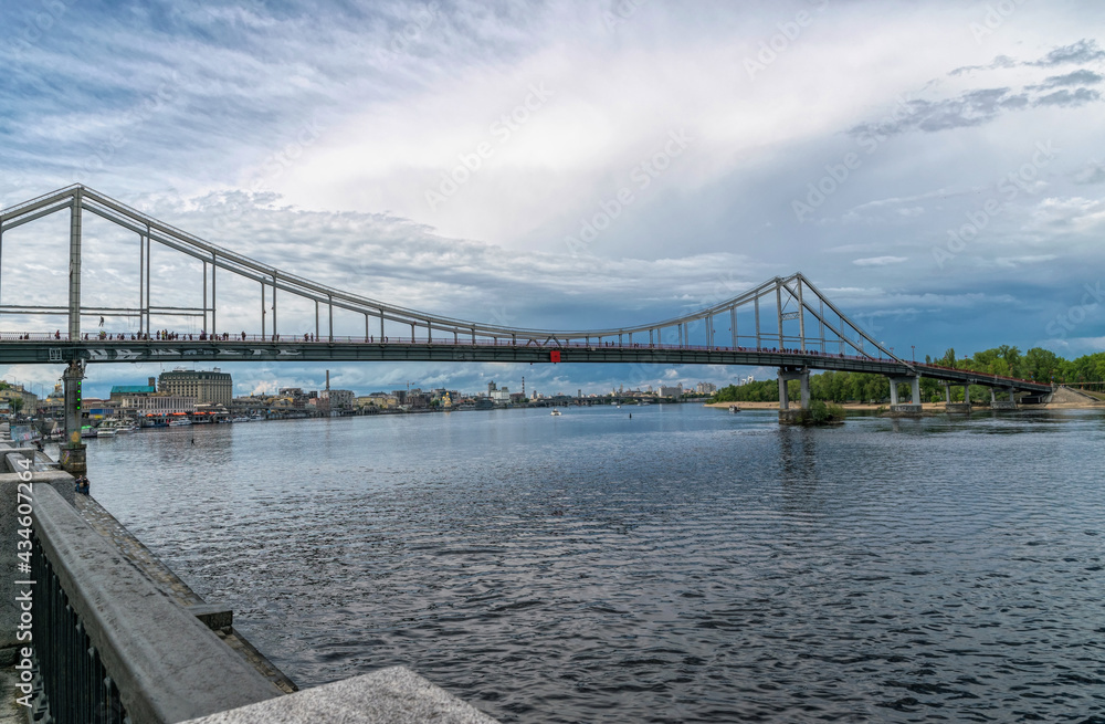 Pedestrian bridge and embankment of the Dnieper river in Kiev, Ukraine