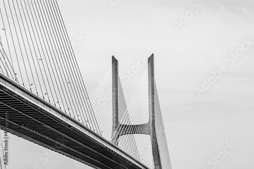 Vasco da Gama bridge in Lisbon, Portugal; cable stayed bridge flanked by viaducts and rangeviews that spans the Tagus river in Parque das Nacoes, the second longest bridge in Europe photo