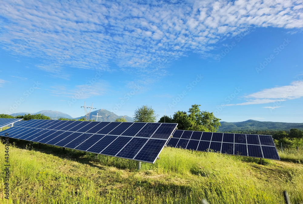 solar panels grass sky clouds electricity energy solar panels grass sky clouds electricity energy