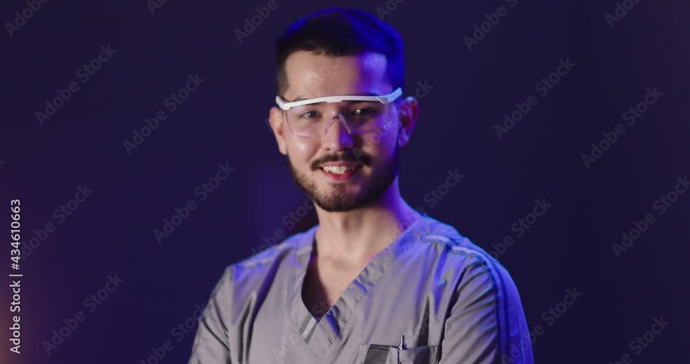 Portrait shot of healthcare worker looking at camera. Young scientist in a lab. Practitioner doctor in office. Healthcare services, health and safety concept 4k footage Portrait shot of healthcare worker looking at camera. Young scientist in a lab. Practitioner doctor in office. Healthcare services, health and safety concept 4k footage