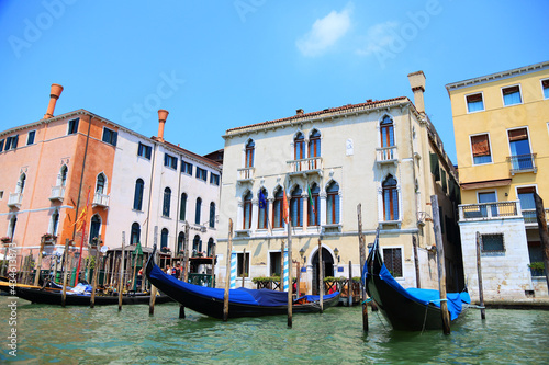 Venice on a summer day. Gondolas ready to receive tourists