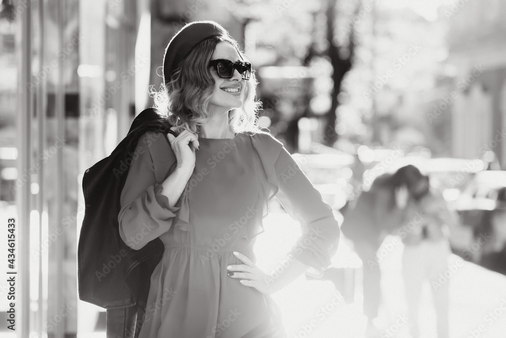 Obraz premium fashion portrait of young beautiful stylish woman walking in city street, style trend, drinking coffee.