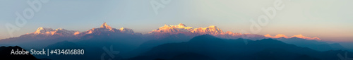 Panorama of Annapurna in Himalaya mountain range with sunset colors, Pokhara, Nepal