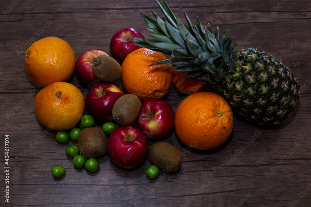 different fruits on wooden background close up