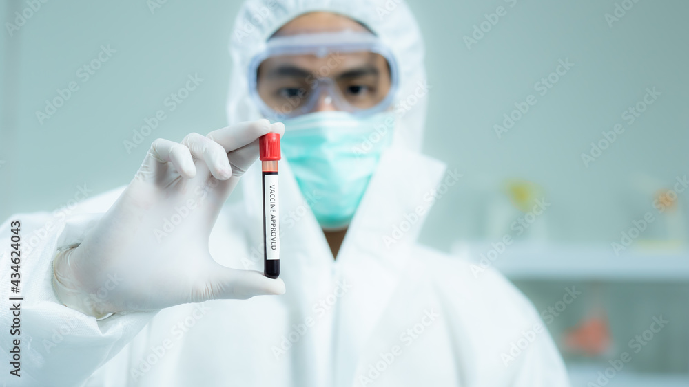 Blood sample in test tube with Vaccinated for COVID-19 analyzing. Diagnosis and examination of coronavirus, covid-19 have negative results is successful in the treatment trial, clinical research. Blood sample in test tube with Vaccinated for COVID-19 analyzing. Diagnosis and examination of coronavirus, covid-19 have negative results is successful in the treatment trial, clinical research.