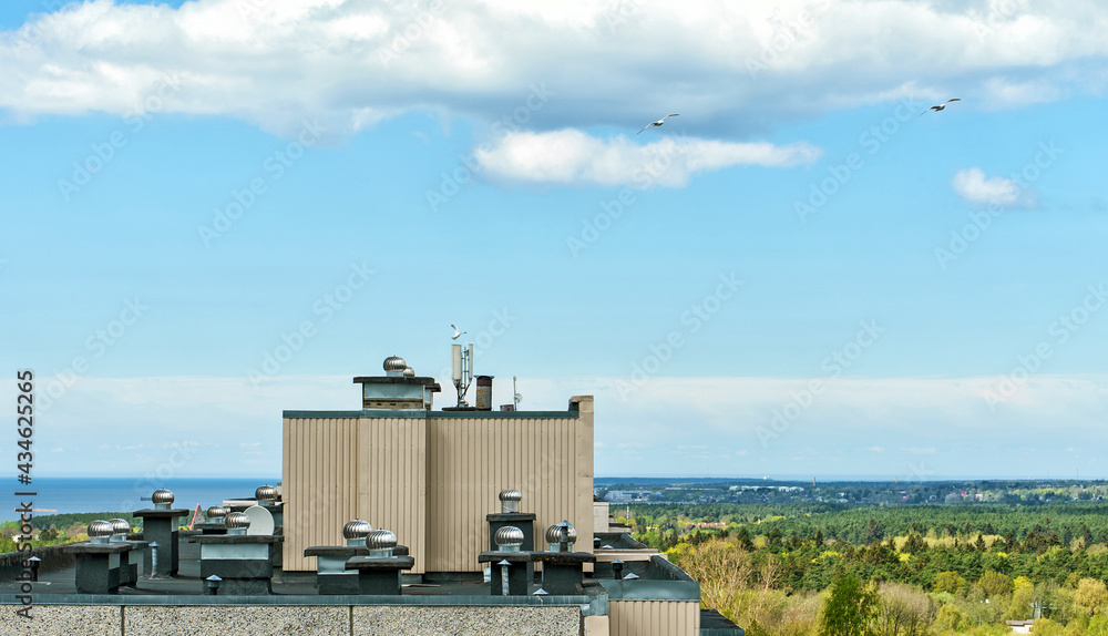 Obraz premium Rotary deflectors on the apartment house rooftop.
