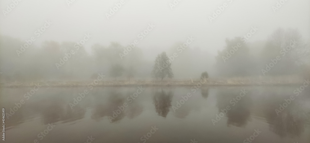 Beautiful scenic foggy river in the morning.