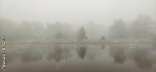 Beautiful scenic foggy river in the morning.
