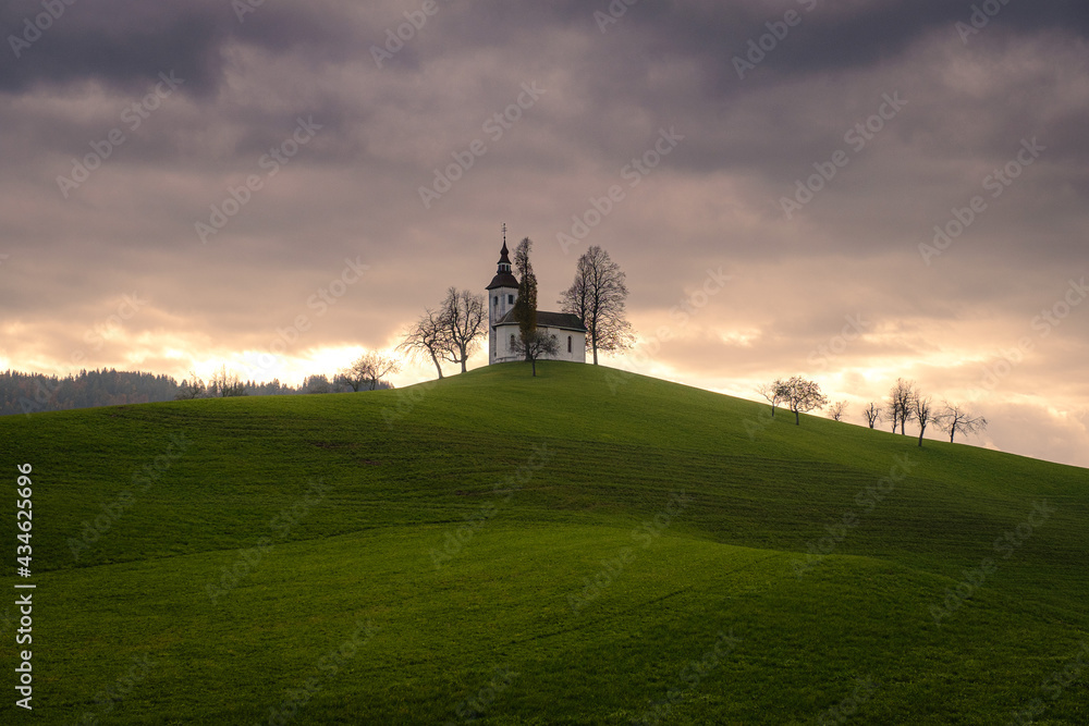 Fototapeta premium Mystic Saint Thomas Church in clouds