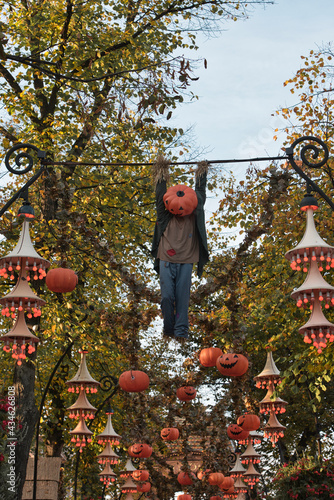 Halloween decoration at Tivoli in Copenhagen, Denmark. . High quality photo Halloween decoration theme in an outdoor public garden, scary pumpkins on the ground.