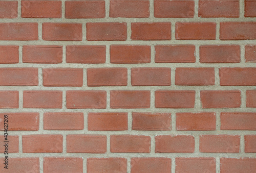 Orange brown brick background, Abstract geometric pattern texture, Old outdoor building brick block wall, Can be used as background for display or montage your products.