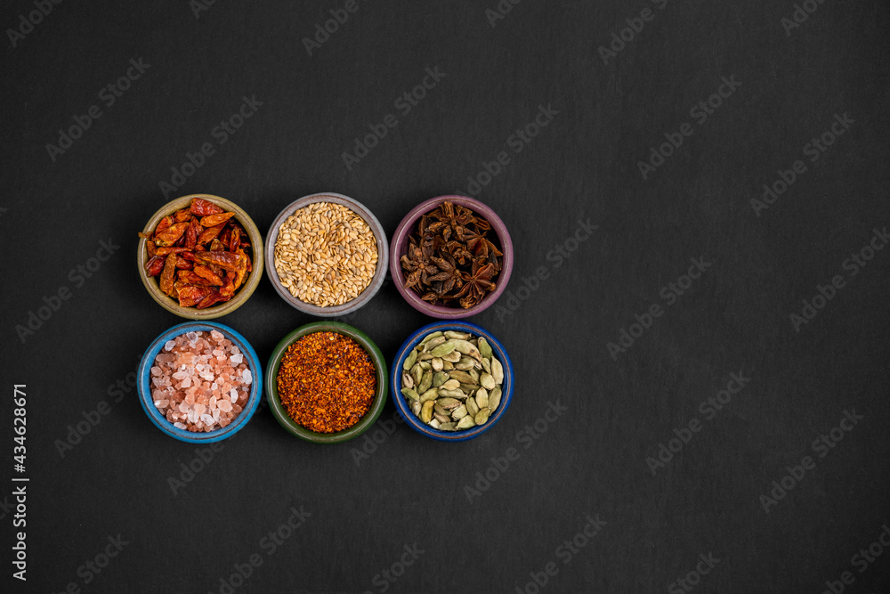 top view of spices in mini bowl with himalayan salt, cayenne, sesame, anise top view of spices in mini bowl with himalayan salt, cayenne, sesame, anise