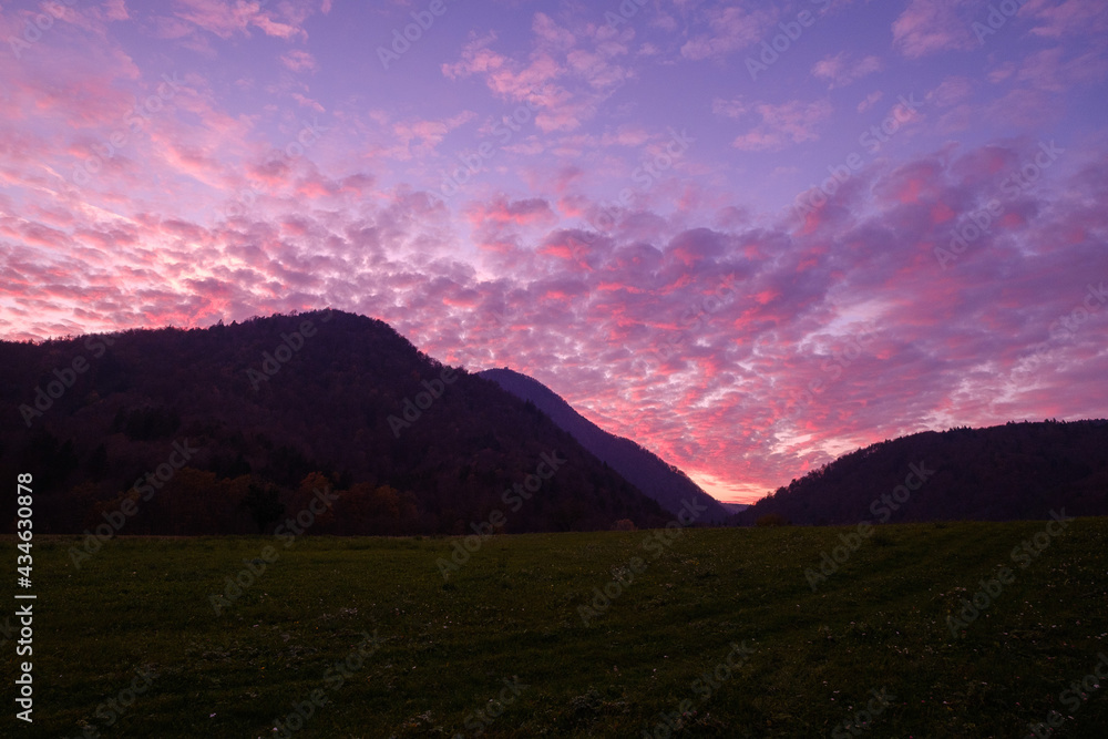Pink sunset behind Lubnik hill in Skofja Loka