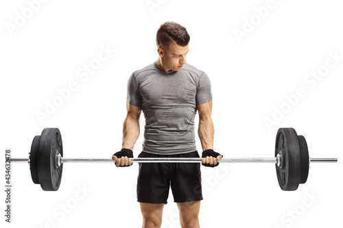 Guy lifting weights and looking downwards