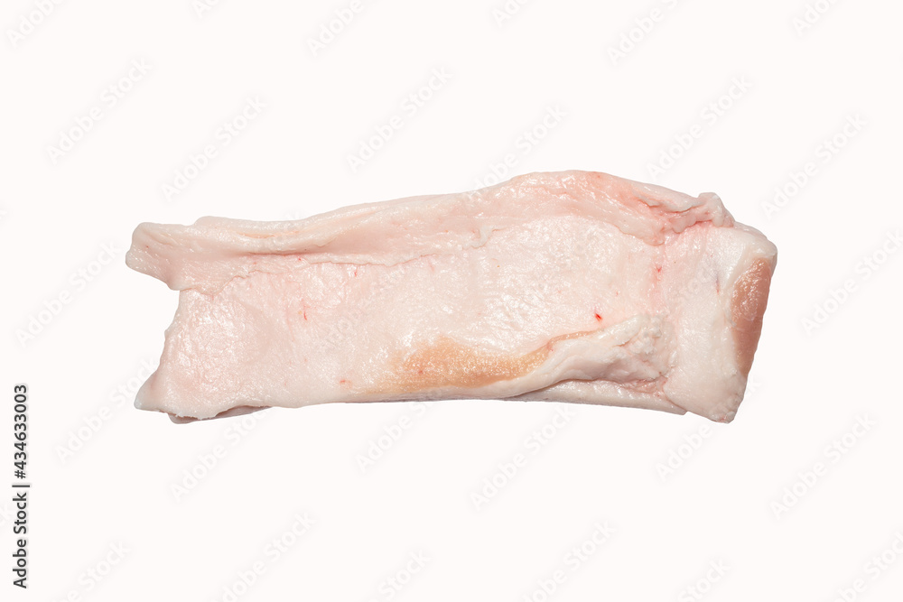A piece of raw lard on a white background.Pork fat background top view.Pieces of pork skin and fat isolated. A piece of raw lard on a white background.Pork fat background top view.Pieces of pork skin and fat isolated.