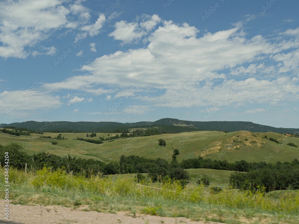 Wyoming state landscape with lush sloping hills and meadows. Wyoming state landscape with lush sloping hills and meadows.