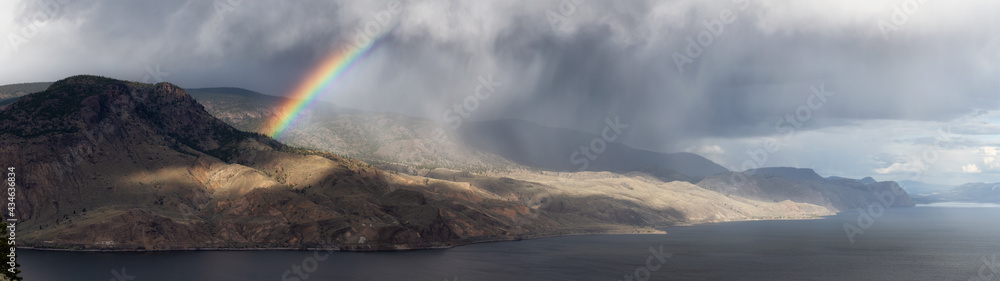 Panoramic View of Canadian Mountain Landscape in Desert by the Lake. Dramatic Stormy and Rainy Weather with Rainbow. Near Kamloops, British Columbia, Canada.