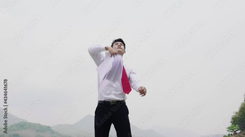 Asian Businessman Throwing Papers, Slow Motion
Asian Businessman Throwing Papers, Slow Motion