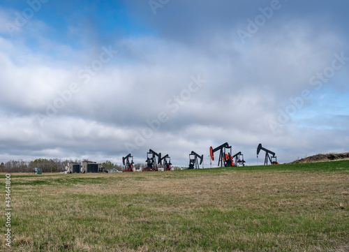 Oil wells on the horizon near Airdrie, Alberta, Canada