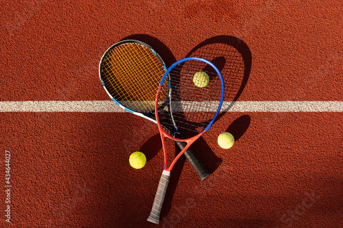Tennis game. Tennis ball with racket on the tennis court. Sport, recreation concept. © Angelov